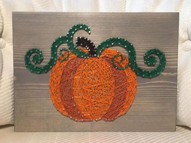 Orange String Pumpkin On Wood