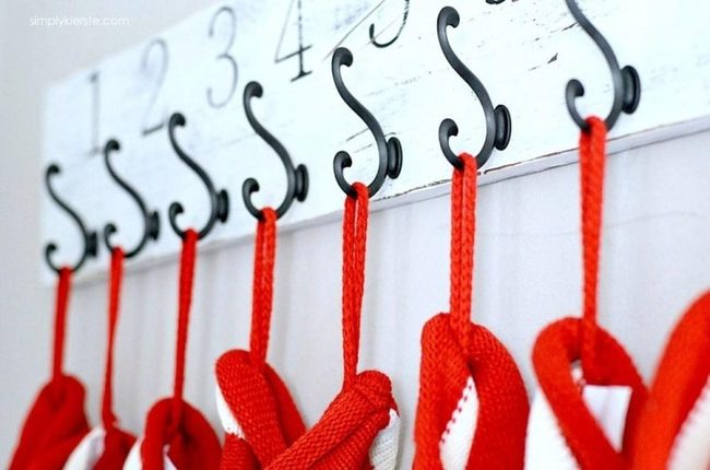 Red Mittens On Numbered Hooks