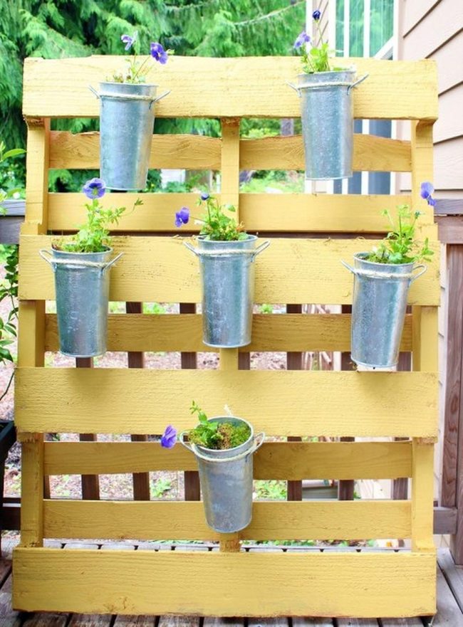 Yellow Pallet Garden With Purple Blooms